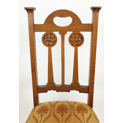 264A - ARTS AND CRAFTS SIDE CHAIRS, a pair, circa 1905 oak the back-splats with carved roundels, overstuffe... 