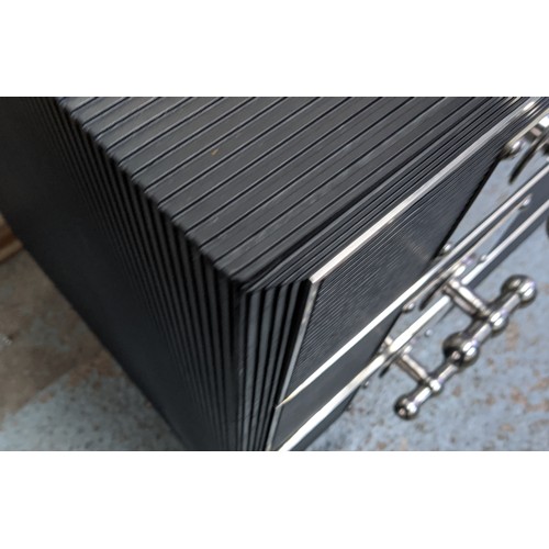 639 - CHEST OF DRAWERS, 113.5cm x 58cm x 77.5cm, ridged black finish with three drawers, oversized polishe... 