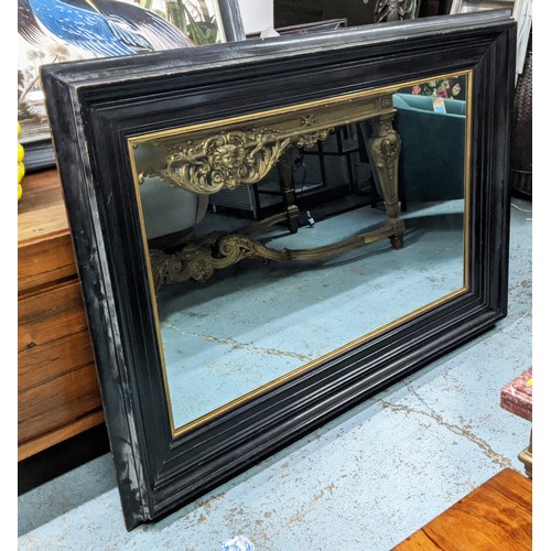 638 - WALL MIRROR, 19th century ebonised with gilt slip, 164cm x 115cm.