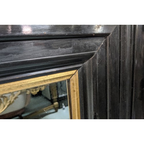 638 - WALL MIRROR, 19th century ebonised with gilt slip, 164cm x 115cm.