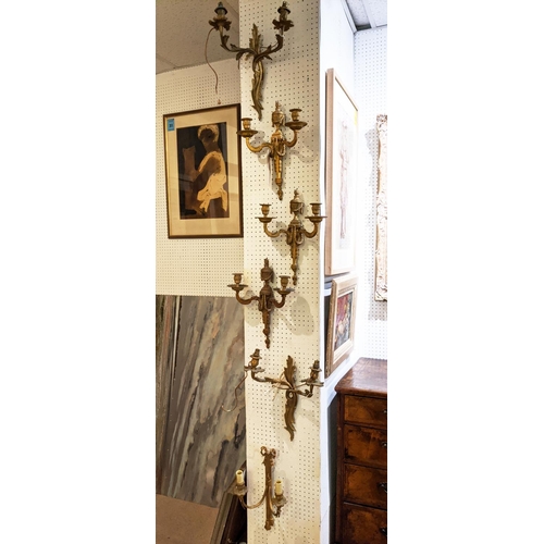 176 - WALL SCONCES, a set of three, Louis XVI style gilt metal with urn detail, each 40cm H x 31cm W, a pa... 