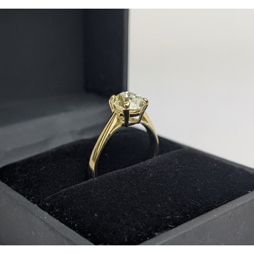 30 - A DIAMOND SOLITAIRE RING, the old mine cut stone of approximately 1.50 carat, yellow metal shank, cl... 