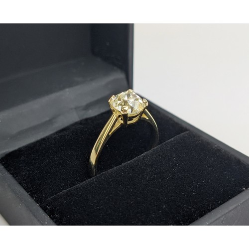 30 - A DIAMOND SOLITAIRE RING, the old mine cut stone of approximately 1.50 carat, yellow metal shank, cl... 