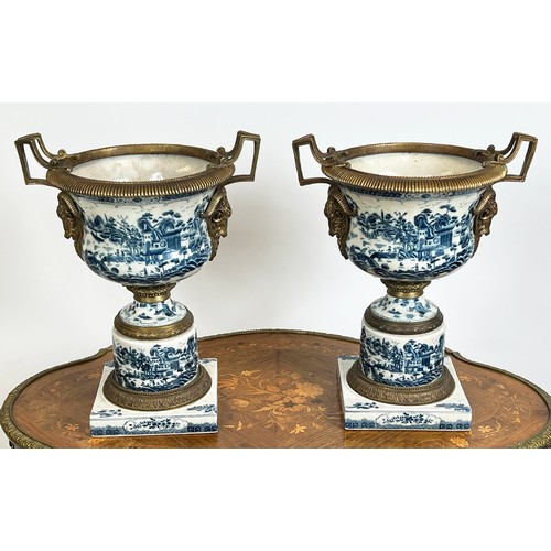 19 - JARDINIERES, a pair, 18th century style Chinese export, blue and white porcelain and gilt metal moun... 