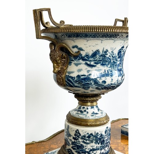 19 - JARDINIERES, a pair, 18th century style Chinese export, blue and white porcelain and gilt metal moun... 