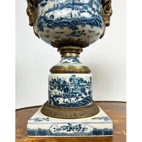 19 - JARDINIERES, a pair, 18th century style Chinese export, blue and white porcelain and gilt metal moun... 