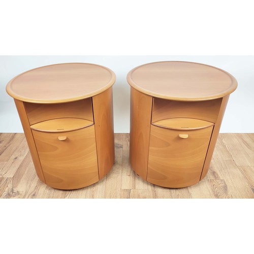 409 - SIDE CABINETS, pair, of cylindrical form, each with a drawer, brushing slide and cupboard door below... 