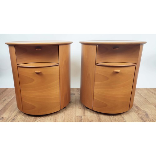 409 - SIDE CABINETS, pair, of cylindrical form, each with a drawer, brushing slide and cupboard door below... 