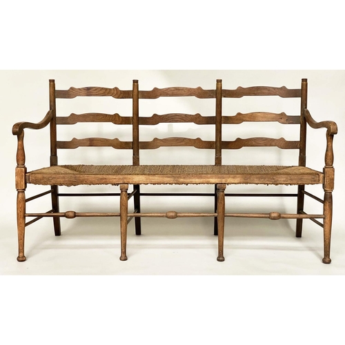 488 - HALL BENCH, early 20th century English oak with ladder back and rush seat, 157cm W.