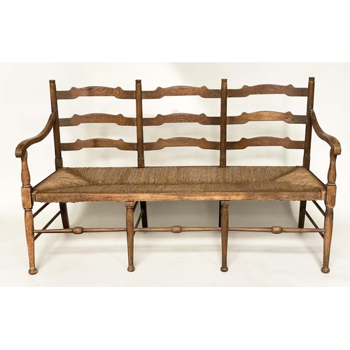 488 - HALL BENCH, early 20th century English oak with ladder back and rush seat, 157cm W.