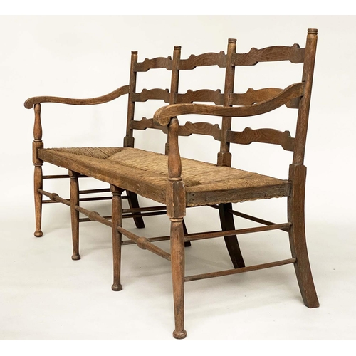 488 - HALL BENCH, early 20th century English oak with ladder back and rush seat, 157cm W.