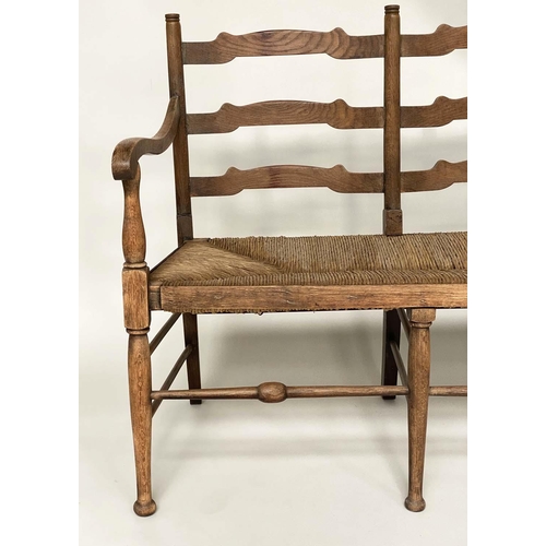 488 - HALL BENCH, early 20th century English oak with ladder back and rush seat, 157cm W.