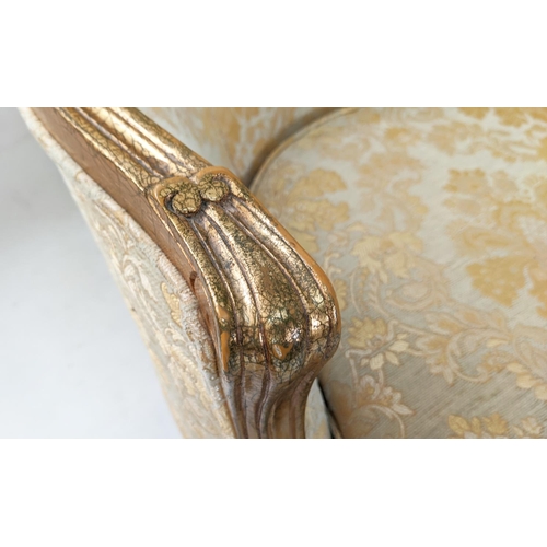 134 - BERGERES, a pair, each 68cm x 93cm H with gilt showframes and gold patterned upholstery. (2)