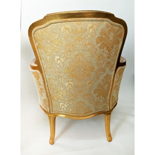 134 - BERGERES, a pair, each 68cm x 93cm H with gilt showframes and gold patterned upholstery. (2)