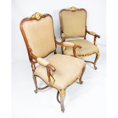 136 - OPEN ARMCHAIRS, a pair, each 68cm x 115cm H, with carved showframes and gilt detail. (2)