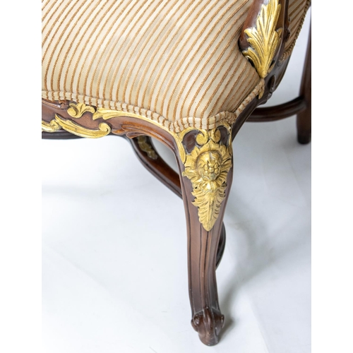 136 - OPEN ARMCHAIRS, a pair, each 68cm x 115cm H, with carved showframes and gilt detail. (2)