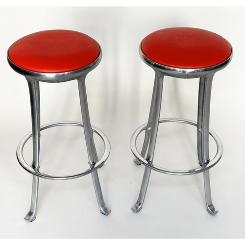 214 - BAR STOOLS, a pair, Joan Casa Ortinex Indescasa cast aluminum circular with red wipeable seats and f... 