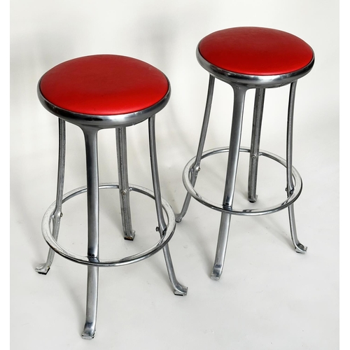 214 - BAR STOOLS, a pair, Joan Casa Ortinex Indescasa cast aluminum circular with red wipeable seats and f... 