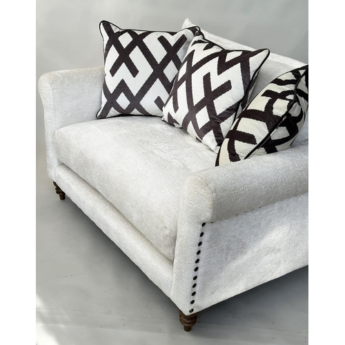 293 - SOFA, Harrison two seater in cream/off white cut velvet chenille with scroll arms, studded sides and... 