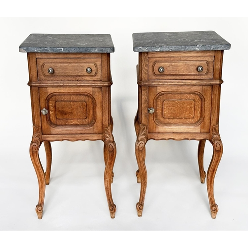 296 - BEDSIDE CABINETS, a pair, 19th century French oak each with drawer and panelled door and St Annes va... 