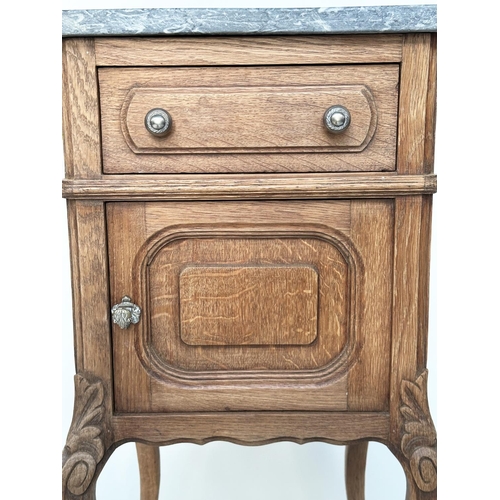 296 - BEDSIDE CABINETS, a pair, 19th century French oak each with drawer and panelled door and St Annes va... 