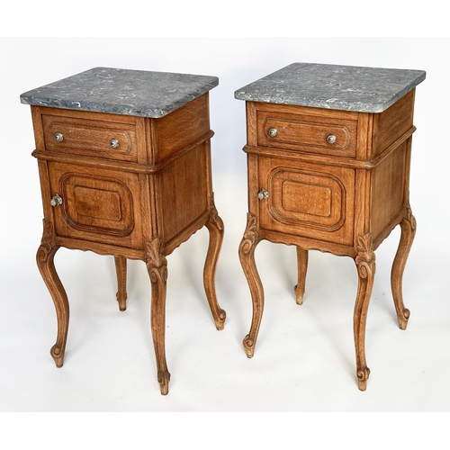 296 - BEDSIDE CABINETS, a pair, 19th century French oak each with drawer and panelled door and St Annes va... 