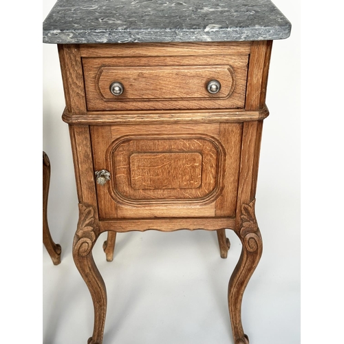 296 - BEDSIDE CABINETS, a pair, 19th century French oak each with drawer and panelled door and St Annes va... 