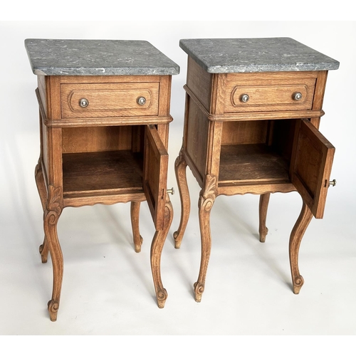 296 - BEDSIDE CABINETS, a pair, 19th century French oak each with drawer and panelled door and St Annes va... 