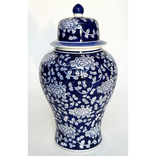 297 - TEMPLE JAR, Chinese white and indigo blue ceramic of lidded vase form, 53cm H.