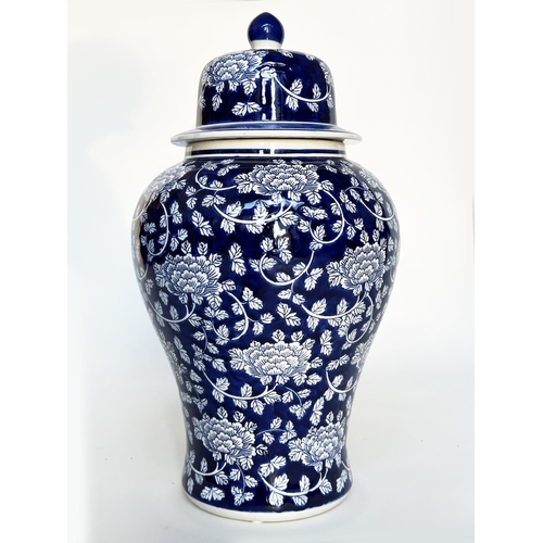 297 - TEMPLE JAR, Chinese white and indigo blue ceramic of lidded vase form, 53cm H.