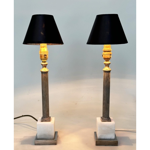 299 - COLUMN TABLE LAMPS, a pair, with silvered reeded columns and square marble plinths, with shades, 48c... 