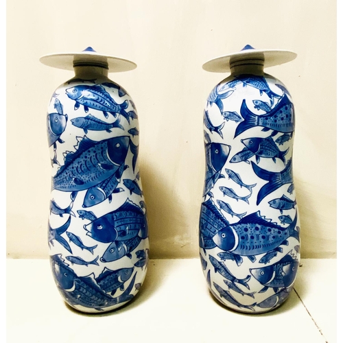 360 - JARS WITH COVERS, a pair, blue and white ceramic with carp decoration, 44cm high, 17cm diam. (2)