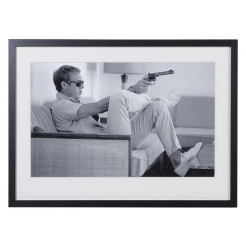 373 - STEVE MCQUEEN WITH A GUN, photographic print, framed and glazed, 54cm x 74cm.