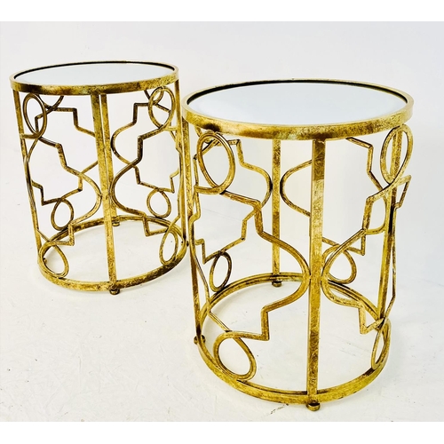 374 - SIDE TABLES, a pair, 56cm high, 46cm diameter, gilt metal lattice design frames, mirror glass tops. ... 