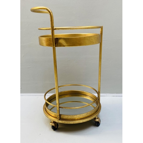 388 - COCKTAIL TROLLEY, 77cm high, 42cm diameter, 1960s French style, mirrored glass tiers, gilt metal fra... 