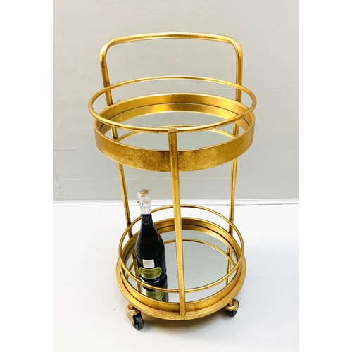 388 - COCKTAIL TROLLEY, 77cm high, 42cm diameter, 1960s French style, mirrored glass tiers, gilt metal fra... 