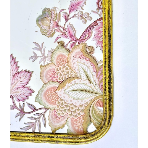 390 - WALL MIRRORS, a set of three, all with floral decoration, gilt frames, 64cm high, 40cm wide. (3)