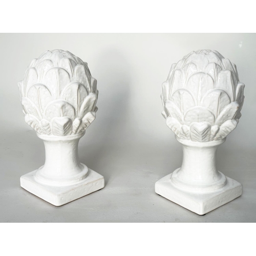 431 - ARTICHOKES, a pair, white ceramic on columns and plinths, 30cm H. (2)