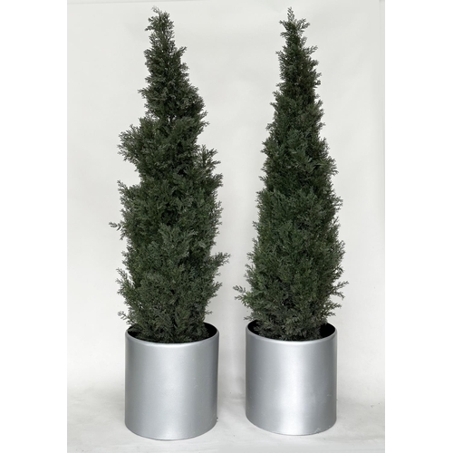 440 - ARTIFICIAL CONIFERS, a pair, in silvered metal drum planters, planters 49cm W, heights overall appro... 