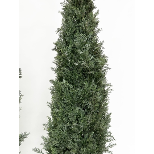 440 - ARTIFICIAL CONIFERS, a pair, in silvered metal drum planters, planters 49cm W, heights overall appro... 