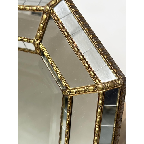 451 - WALL MIRROR, Venetian style octagonal gilt metal mounted with bevelled mirror and raised marginal pl... 