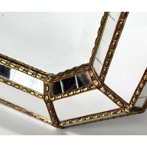 451 - WALL MIRROR, Venetian style octagonal gilt metal mounted with bevelled mirror and raised marginal pl... 