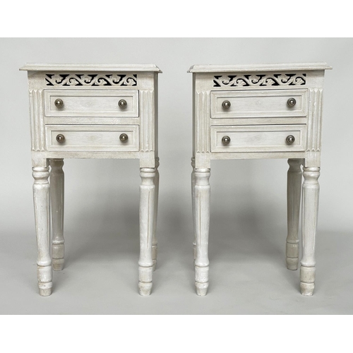 452 - BEDSIDE CHESTS, a pair, French traditionally grey painted each with two drawers and pierced frieze, ... 