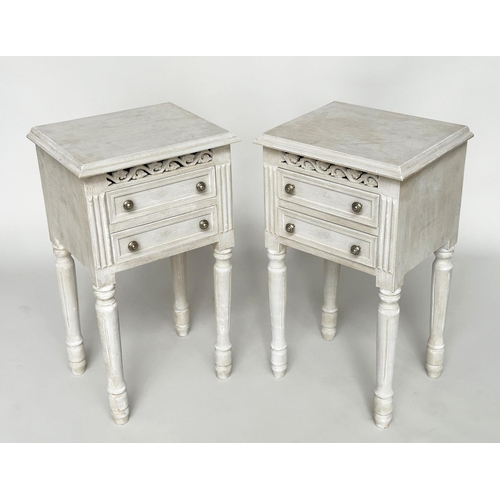 452 - BEDSIDE CHESTS, a pair, French traditionally grey painted each with two drawers and pierced frieze, ... 