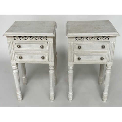 452 - BEDSIDE CHESTS, a pair, French traditionally grey painted each with two drawers and pierced frieze, ... 