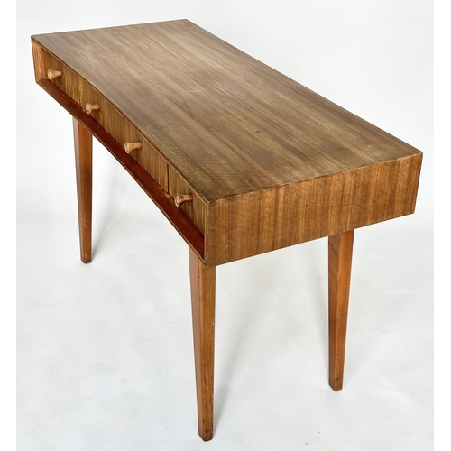 462 - HEALS WRITING TABLE, 1970's teak, concave fronted with three frieze drawers and splay supports attri... 