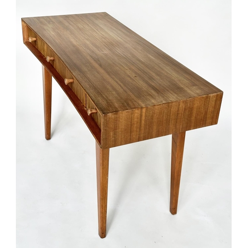 462 - HEALS WRITING TABLE, 1970's teak, concave fronted with three frieze drawers and splay supports attri... 