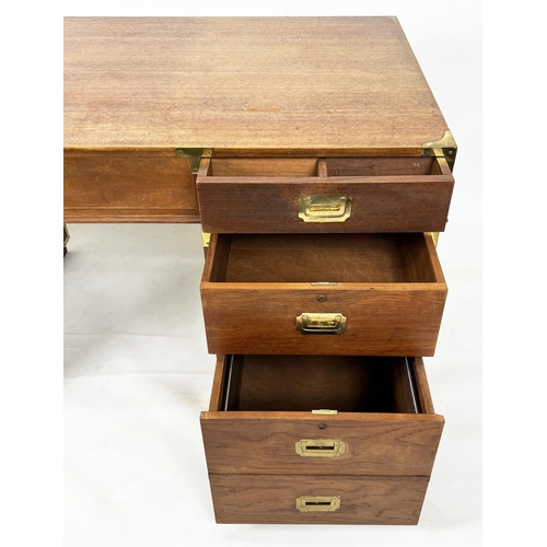 485 - CAMPAIGN STYLE PEDESTAL DESK, teak and brass bound, with an arrangement of seven drawers, 78cm H x 1... 