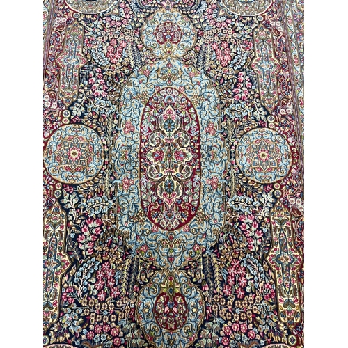 87 - FINE PERSIAN LAVER KERMAN CARPET, 320cm x 197cm.