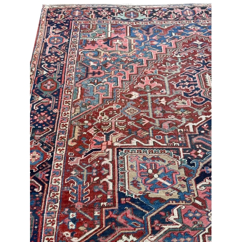 94 - ANTIQUE PERSIAN HERIZ CARPET, 345cm x 245cm.